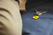 Unpluq Tag on couch